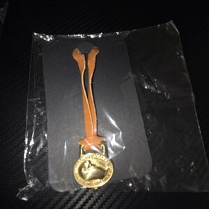 Dooney & Bourkw Gold and Tan Charms